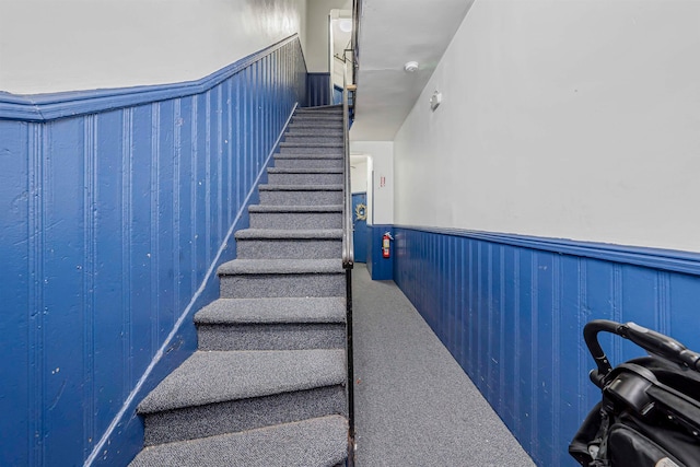 stairs featuring carpet