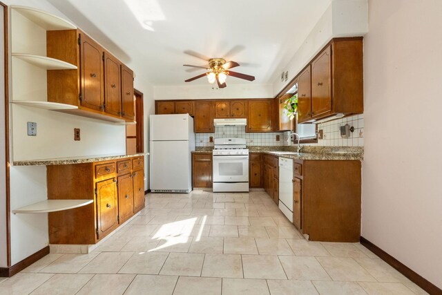 22 W 34th St Unit G, Bayonne, NJ 07002 - kitchen with white appliances, open shelves, under cabinet range hood, a ceiling fan, and backsplash