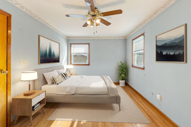 22 W 34th St Unit G, Bayonne, NJ 07002 - bedroom featuring light wood-style flooring, baseboards, and a ceiling fan