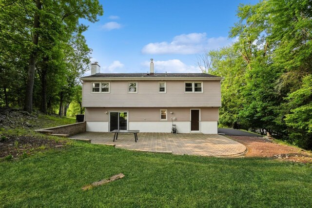151 Mount Pleasant Ave, Dover Town, NJ 07801 - rear view of property with a patio, a yard, and a chimney
