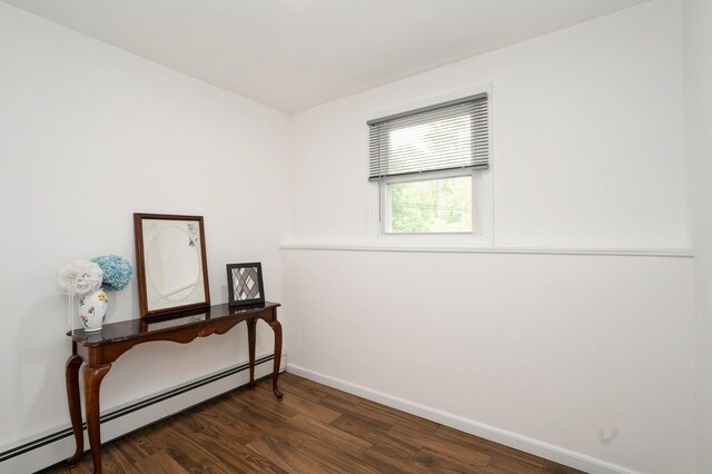 151 Mount Pleasant Ave, Dover Town, NJ 07801 - empty room featuring a baseboard radiator, dark wood-type flooring, and baseboards