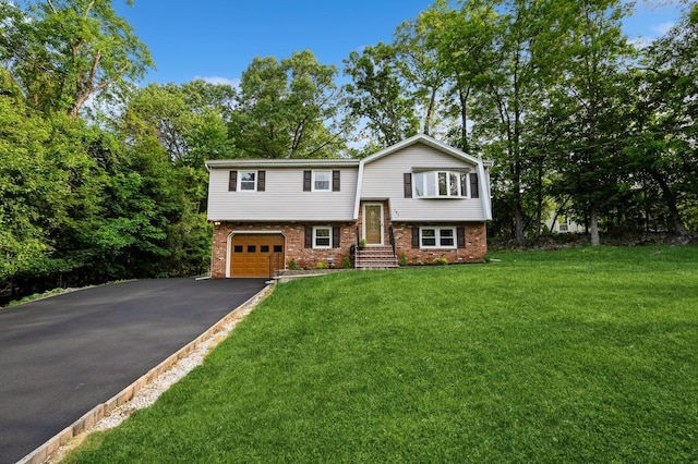 151 Mount Pleasant Ave, Dover Town, NJ 07801 - split foyer home featuring asphalt driveway, brick siding, an attached garage, and a front yard