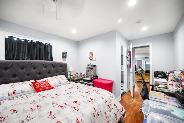 bedroom with ceiling fan, wood finished floors, and recessed lighting