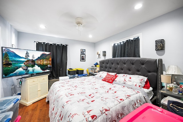 bedroom with ceiling fan, wood finished floors, and recessed lighting