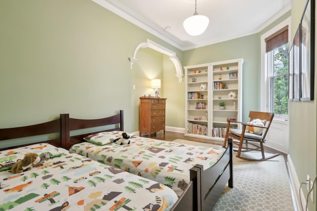 254 4th St, Jersey City, NJ 07302 - bedroom with crown molding, arched walkways, and baseboards