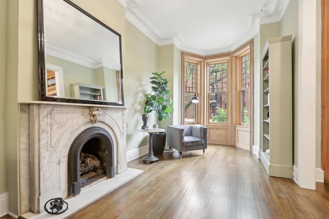 254 4th St, Jersey City, NJ 07302 - living area featuring wood finished floors, baseboards, crown molding, and a high end fireplace