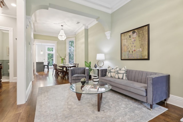 254 4th St, Jersey City, NJ 07302 - living room with crown molding, wood finished floors, arched walkways, and baseboards