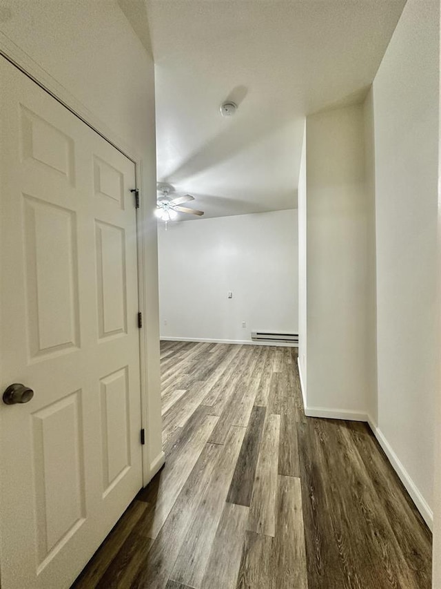 549 Pavonia Ave Unit 1 & 2, Jersey City, NJ 07306 - corridor with a baseboard heating unit, dark wood-style floors, and baseboards