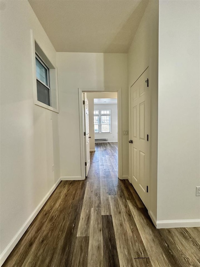 549 Pavonia Ave Unit 1 & 2, Jersey City, NJ 07306 - corridor with dark wood finished floors, baseboards, and baseboard heating