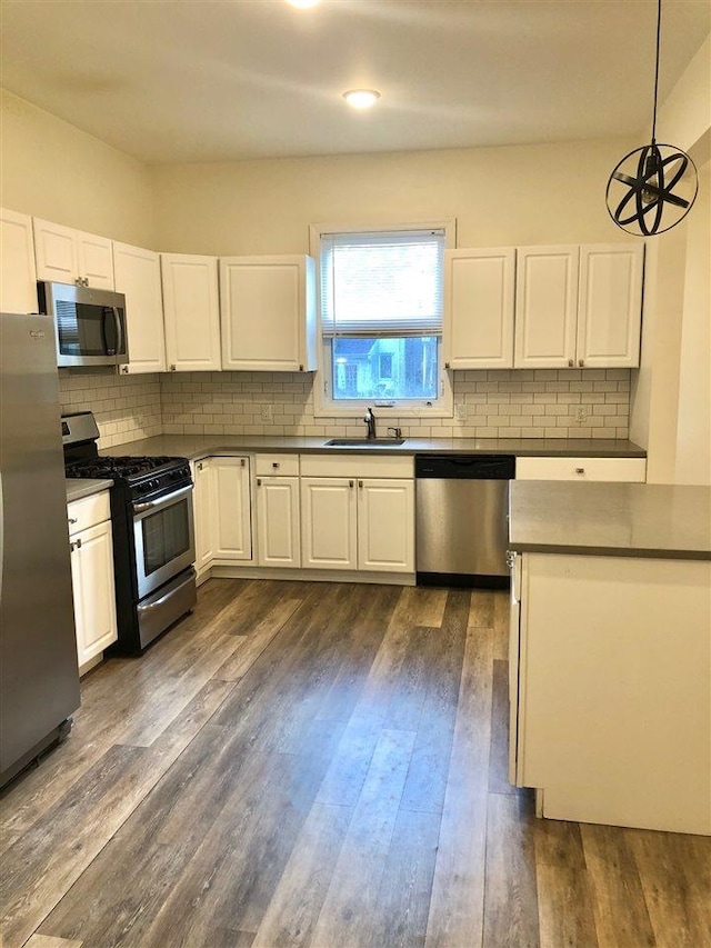 549 Pavonia Ave Unit 1 & 2, Jersey City, NJ 07306 - kitchen with appliances with stainless steel finishes, dark countertops, a sink, tasteful backsplash, and recessed lighting