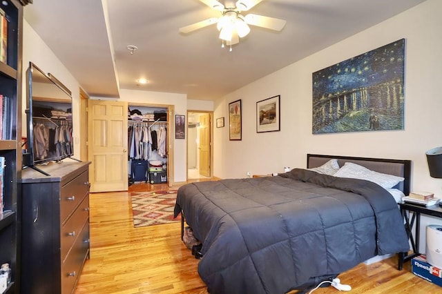 bedroom with a closet and light wood-style floors