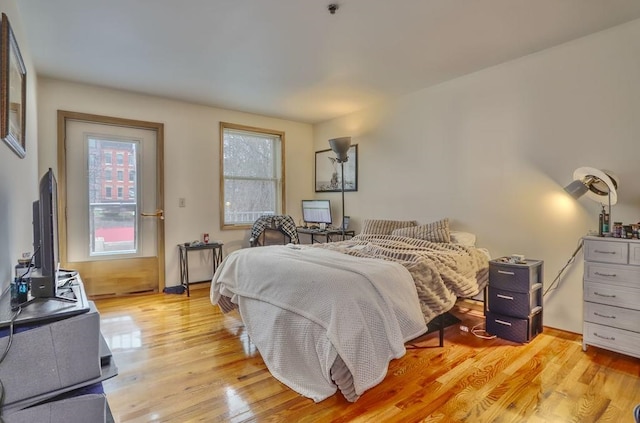 bedroom featuring light wood-style flooring