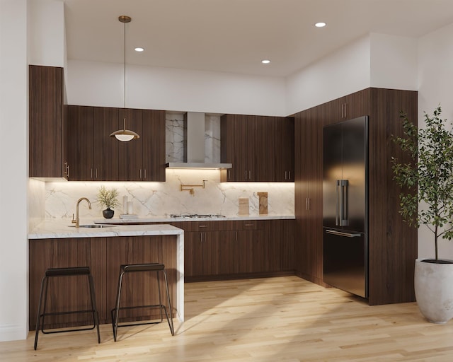17 Leonard St Unit 1, Jersey City, NJ 07307 - kitchen featuring wall chimney range hood, high end refrigerator, modern cabinets, a sink, and recessed lighting