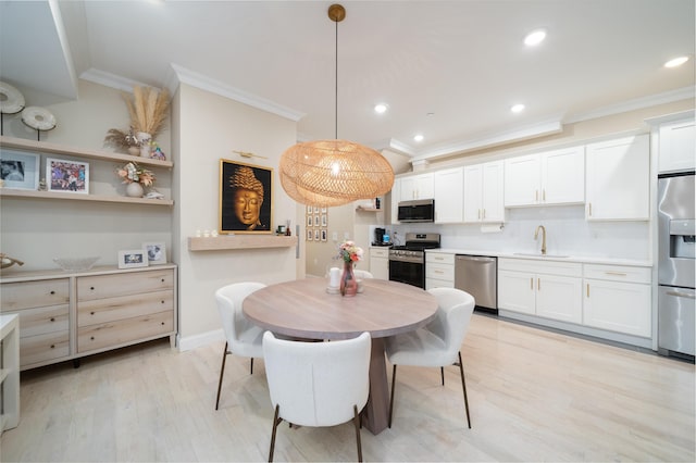 549 Palisade Ave Unit 2, Jersey City, NJ 07307 - dining area with ornamental molding, light wood-style floors, and recessed lighting