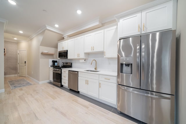 549 Palisade Ave Unit 2, Jersey City, NJ 07307 - kitchen with stainless steel appliances, crown molding, light countertops, white cabinets, and recessed lighting