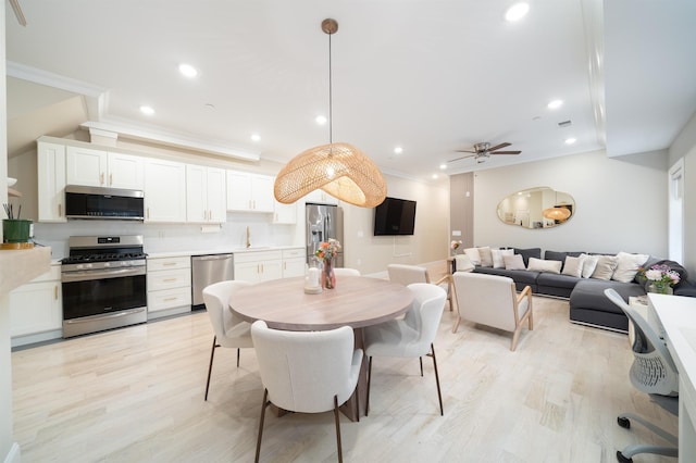 549 Palisade Ave Unit 2, Jersey City, NJ 07307 - dining space featuring ornamental molding, light wood-style flooring, a ceiling fan, and recessed lighting