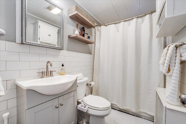 bathroom featuring toilet, vanity, tile walls, and a shower with curtain