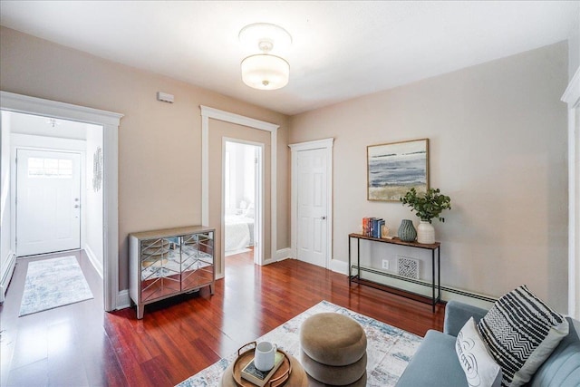 interior space with baseboards and wood finished floors