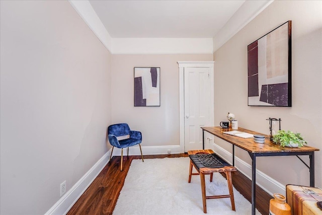 office featuring baseboards and wood finished floors