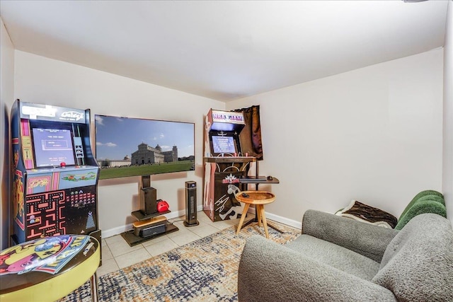 living area featuring tile patterned flooring and baseboards