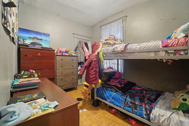 bedroom with light parquet floors