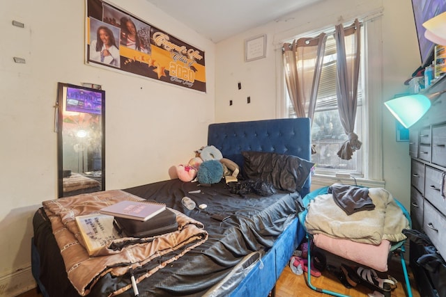 bedroom with parquet floors