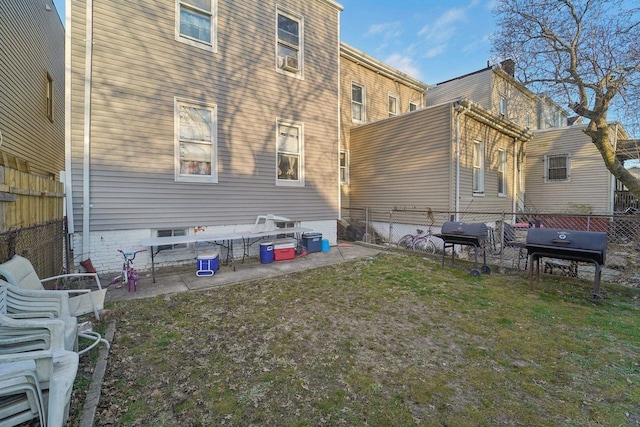 rear view of property featuring a lawn