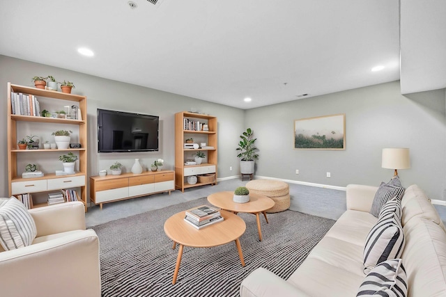 carpeted living room with recessed lighting and baseboards