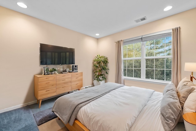 bedroom featuring recessed lighting, carpet flooring, baseboards, and visible vents