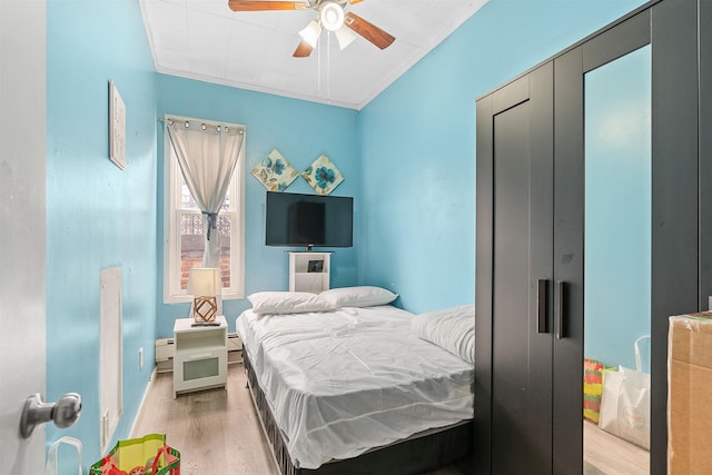 bedroom with a ceiling fan and light wood finished floors