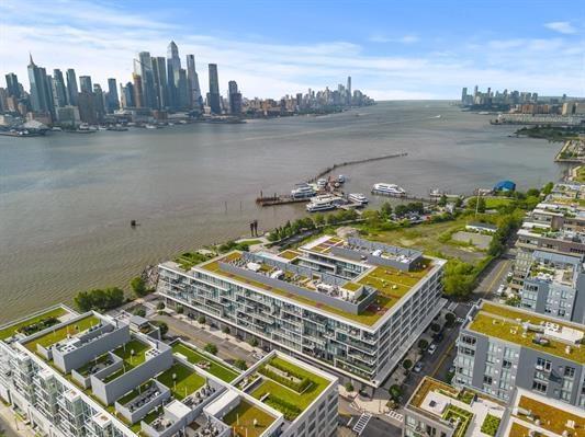 1200 Avenue At Port Imperial Unit 301, Weehawken, NJ 07086 - drone / aerial view of a large body of water and a view of skyline