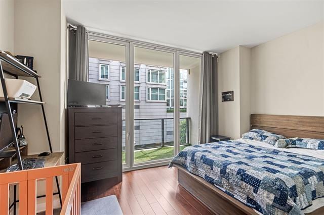 1200 Avenue At Port Imperial Unit 301, Weehawken, NJ 07086 - bedroom featuring access to outside and hardwood / wood-style flooring