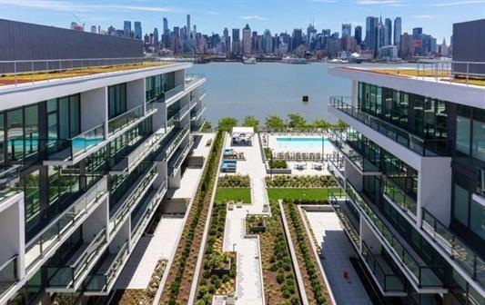 1200 Avenue At Port Imperial Unit 301, Weehawken, NJ 07086 - aerial view of a skyline view, a pool, and a nearby body of water