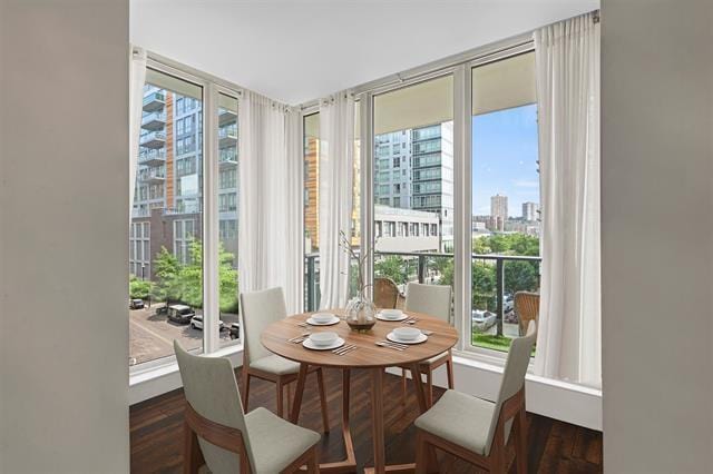 1200 Avenue At Port Imperial Unit 301, Weehawken, NJ 07086 - dining area with healthy amount of natural light, a city view, and wood finished floors