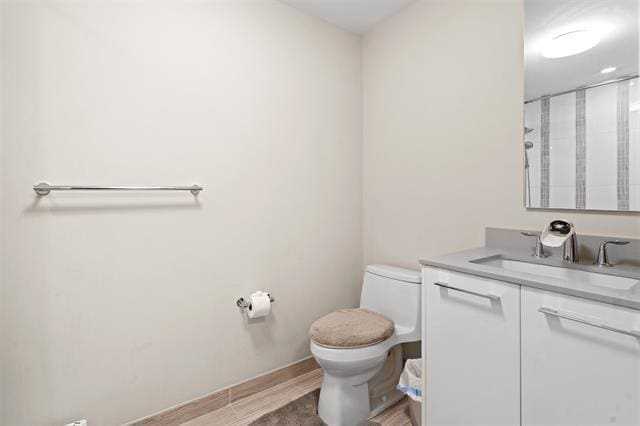 1200 Avenue At Port Imperial Unit 301, Weehawken, NJ 07086 - bathroom featuring toilet, vanity, wood finished floors, and an enclosed shower