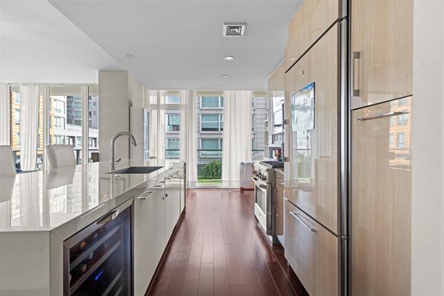 1200 Avenue At Port Imperial Unit 301, Weehawken, NJ 07086 - kitchen with wine cooler, a sink, modern cabinets, high quality appliances, and a spacious island