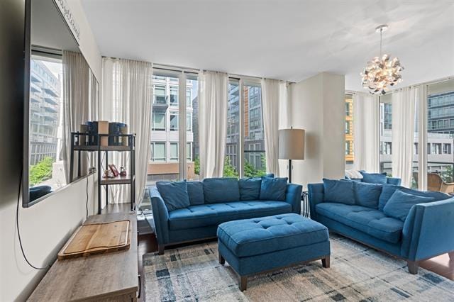 1200 Avenue At Port Imperial Unit 301, Weehawken, NJ 07086 - living area with a chandelier, plenty of natural light, and wood finished floors