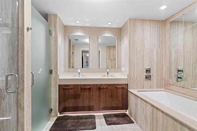 1200 Avenue At Port Imperial Unit 301, Weehawken, NJ 07086 - bathroom with a shower stall, a garden tub, and double vanity