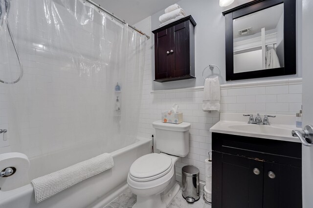 380 7th St Unit 2A, Jersey City, NJ 07302 - full bathroom featuring shower / bathtub combination with curtain, tile walls, vanity, marble finish floors, and a wainscoted wall