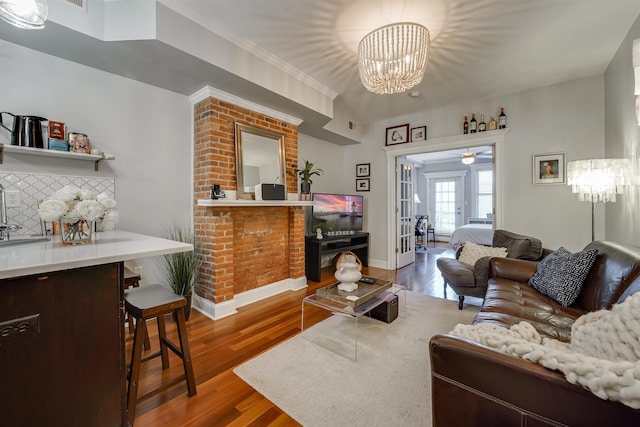 380 7th St Unit 2A, Jersey City, NJ 07302 - living area featuring wood finished floors and a chandelier