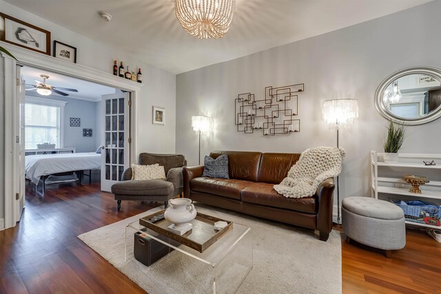 380 7th St Unit 2A, Jersey City, NJ 07302 - living room with wood finished floors, a chandelier, and a ceiling fan