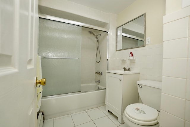 6034 Palisade Ave, West New York, NJ 07093 - bathroom featuring vanity, tile patterned floors, bathing tub / shower combination, a baseboard radiator, and tile walls