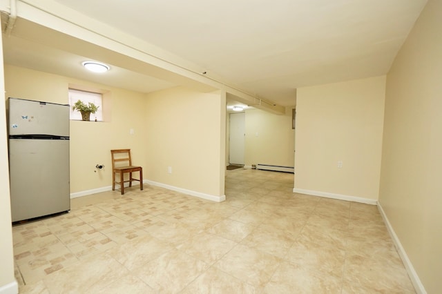 6034 Palisade Ave, West New York, NJ 07093 - basement featuring freestanding refrigerator and a baseboard heating unit