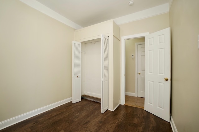 6034 Palisade Ave, West New York, NJ 07093 - unfurnished bedroom with dark wood-style flooring and a closet