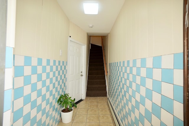 6034 Palisade Ave, West New York, NJ 07093 - corridor featuring tile walls, stairway, and light tile patterned floors
