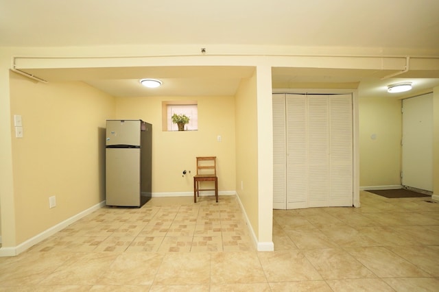 6034 Palisade Ave, West New York, NJ 07093 - below grade area featuring freestanding refrigerator and light tile patterned floors