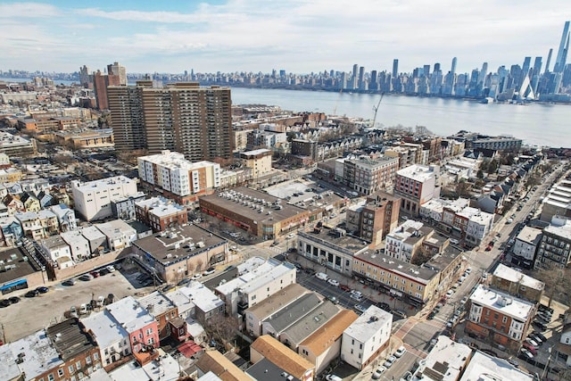 aerial view with a city view and a water view