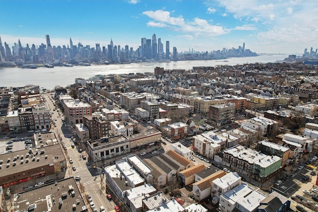 bird's eye view featuring a water view and a view of city