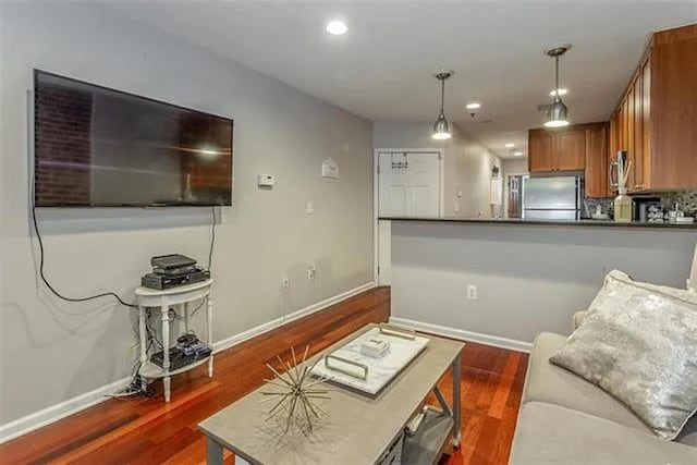 508 Grand St Unit 1L, Hoboken, NJ 07030 - living room featuring baseboards, wood finished floors, and recessed lighting