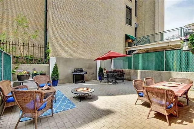 508 Grand St Unit 1L, Hoboken, NJ 07030 - view of patio with outdoor dining space and a fire pit